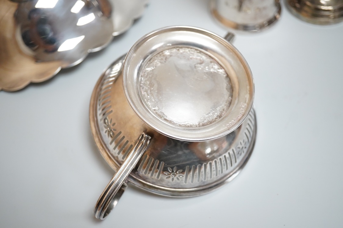 A modern silver oval pedestal sweetmeat bowl, by Mappin & Webb, Birmingham, 1987, 15.8cm, together with a small silver bottle holder, a silver mounted vase and a sterling two handled nut dish.